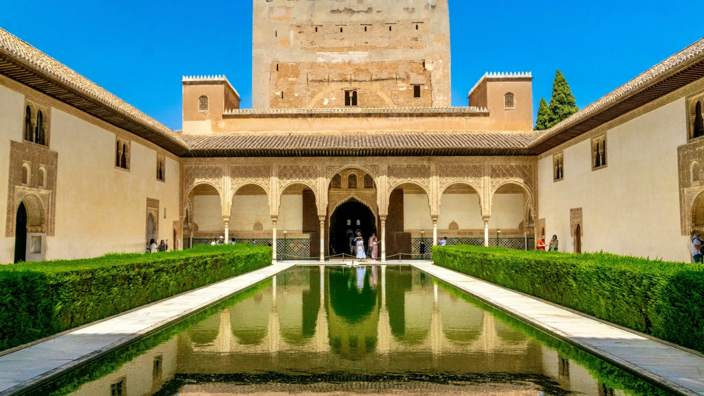 The Alhambra in Granada at golden hour with the snow-capped Sierra Nevada